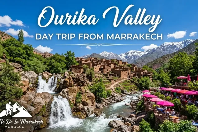 A lush green view of the Ourika Valley with the High Atlas Mountains in the background.